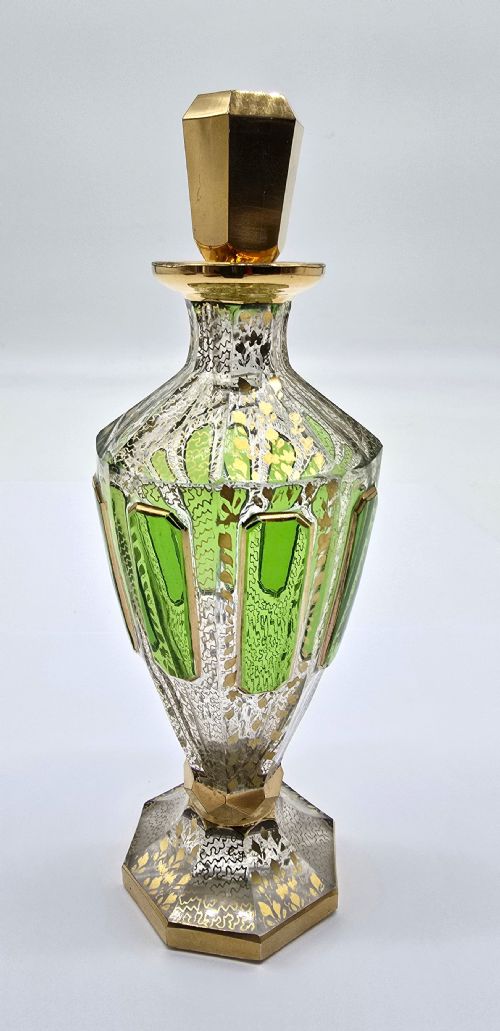 fig 1. A Bohemian glass perfume bottle with green overlay and gilt decoration.