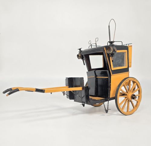 A SCALE MODEL OF A HANSON CAB FROM THE EARLY 19TH CENTURY