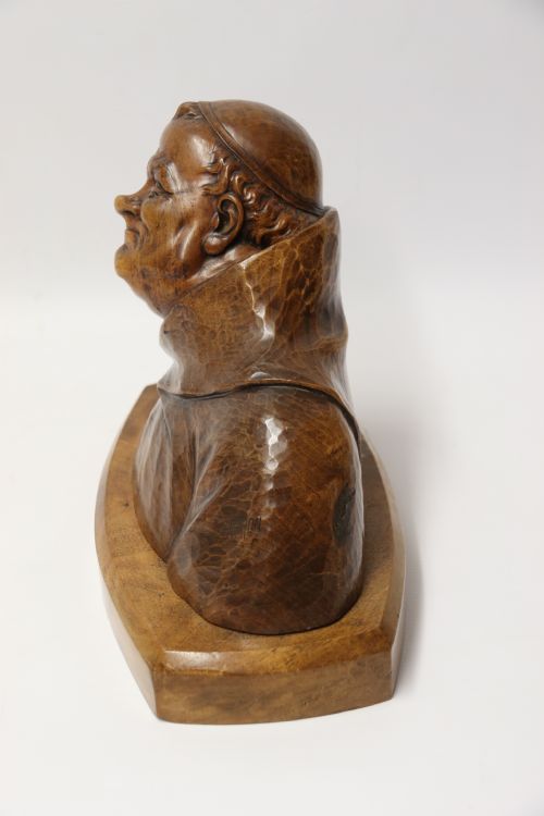 fig 1. A late 19th-century hand-carved walnut study bust depicting a hooded monk on a moulded wooden base.