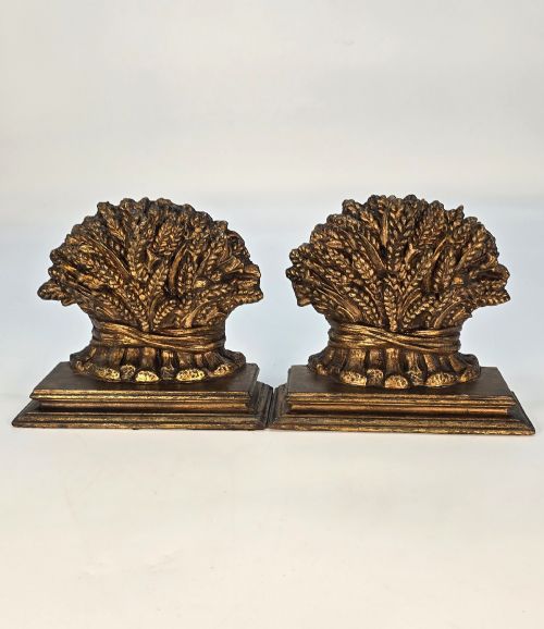 fig 2. A pair of antique Regency period bookends featuring detailed sculpted wheat sheaves with a gilded finish mounted on stepped bases.
