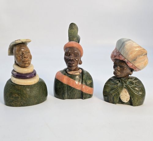 A Group of Three African Carved Stone Portrait Busts.