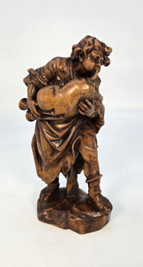 A BLACK FOREST LIMEWOOD CARVED FIGURE OF A MEDIEVAL YOUNG MAN PLAYING SWISS BAGPIPES - ADDITIONAL PHOTO 8