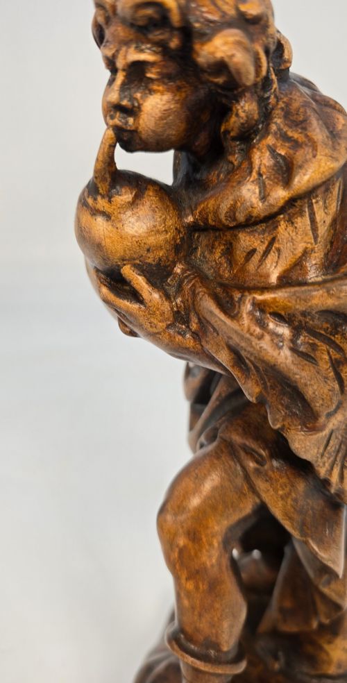 A BLACK FOREST LIMEWOOD CARVED FIGURE OF A MEDIEVAL YOUNG MAN PLAYING SWISS BAGPIPES - ADDITIONAL PHOTO 10