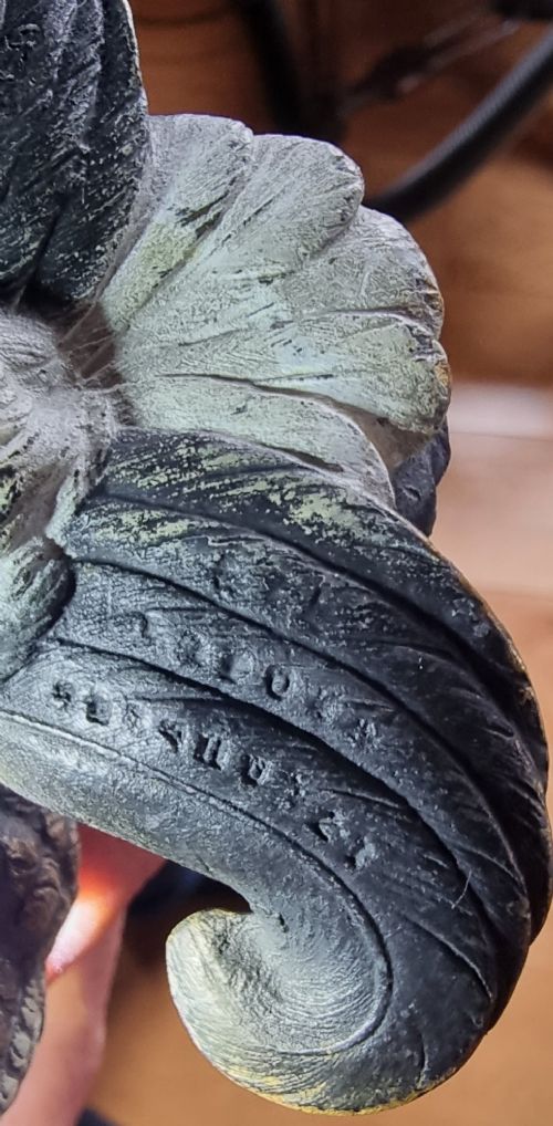 A cold painted bronze sculpture depicting a capercaillie in a display pose with textured dark brown feathers and red eye accents. View XI