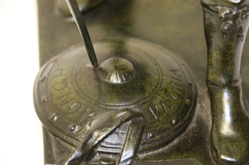 fig 3. A late 19th-century patinated dark bronze sculpture depicting a Roman warrior with a sword resting against a shield on a rectangular base.