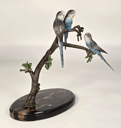 Three Cold Painted Budgerigars Perched on a Leafy Branch