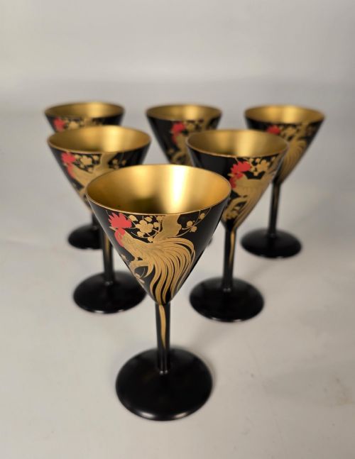 fig 1. A black and gold hand-painted Japanese lacquer cocktail set comprising a shaker, six stemmed glasses, and a rectangular tray adorned with rooster motifs.