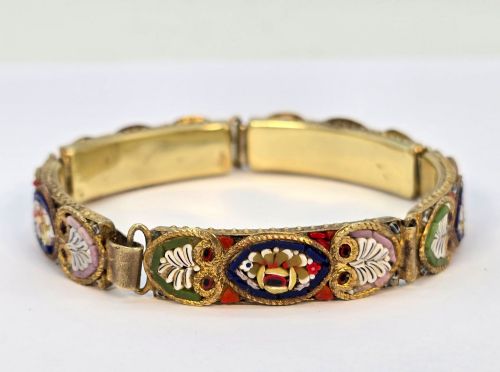 fig 1. An antique gilt metal link bracelet featuring micro mosaic glass panels, including a central oval panel displaying the word Venezia in white lettering against a blue ground.