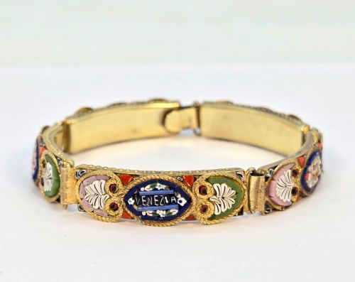 fig 2. An antique gilt metal link bracelet featuring micro mosaic glass panels, including a central oval panel displaying the word Venezia in white lettering against a blue ground.