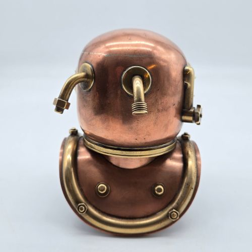 fig 1. A miniature copper and brass 19th-century style diving helmet with circular glass viewports and a curved corselet base.