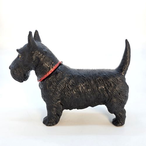 fig 3. A 1920s black cast metal table lighter crafted in the form of a standing Scottish Terrier with a painted red collar.