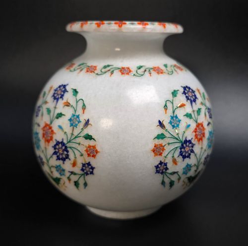 fig 1. A globular white marble vase adorned with detailed floral pietra dura inlay using multi-coloured semi-precious stones.