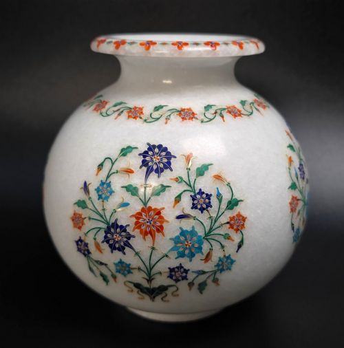 fig 2. A globular white marble vase adorned with detailed floral pietra dura inlay using multi-coloured semi-precious stones.
