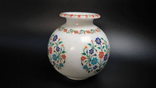 fig 3. A globular white marble vase adorned with detailed floral pietra dura inlay using multi-coloured semi-precious stones.