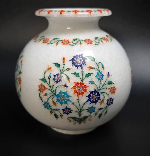 fig 4. A globular white marble vase adorned with detailed floral pietra dura inlay using multi-coloured semi-precious stones.