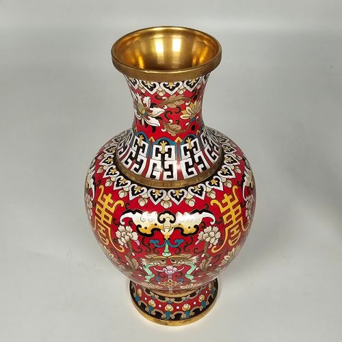 fig 1. A matching pair of baluster-form Chinese cloisonne enamel vases with red backgrounds, lotus motifs, auspicious symbols, and gilt rims.