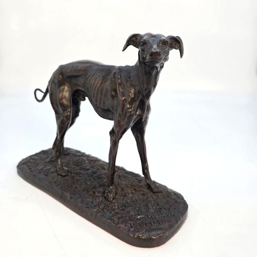 fig 2. A 19th-century dark patinated bronze sculpture of a standing greyhound dog on a textured oval base.