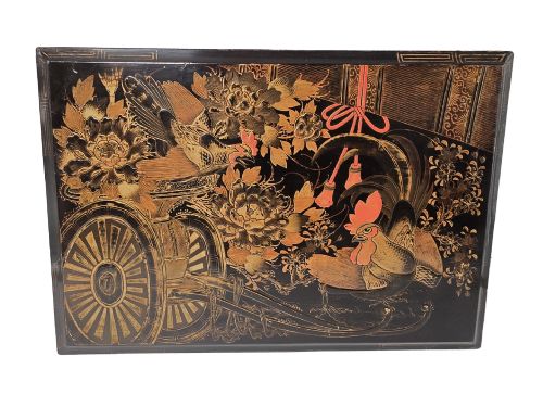 fig 7. An open black lacquer writing box decorated with gold floral and bird motifs, revealing internal stationery compartments.