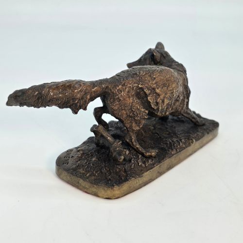 fig 4. A dark brown patinated bronze sculpture depicting a crouching fox on a naturalistic textured base.