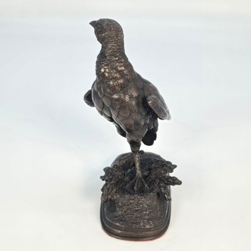 fig 3. A nineteenth-century dark patinated bronze sculpture of a partridge standing on an integral naturalistic base.