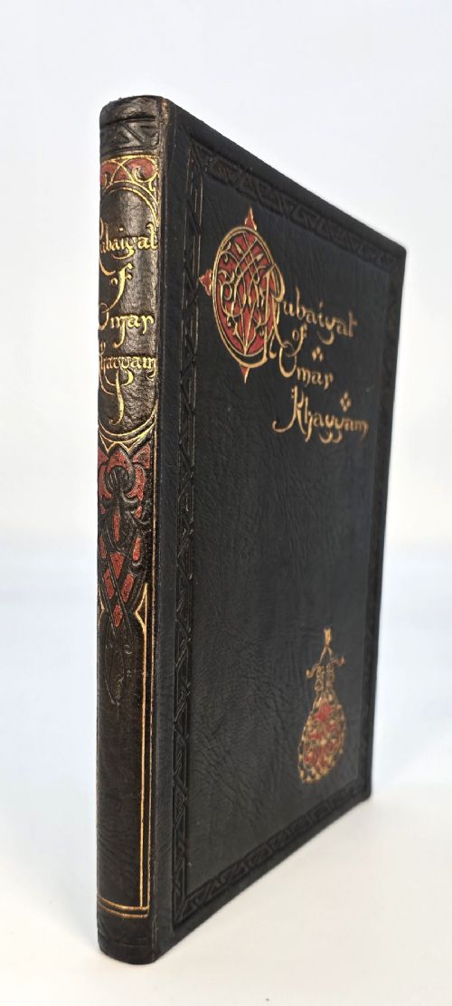 An early 20th-century dark leather-bound copy of the Rubaiyat of Omar Khayyam featuring gilt lettering and red illuminated strapwork detailing. View XIII