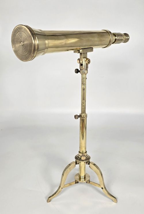 fig 3. A Victorian brass tabletop telescope mounted on an adjustable folding brass tripod stand.