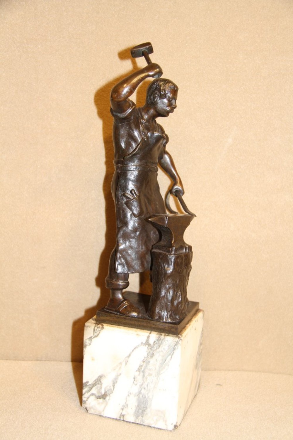 A bronze study of a blacksmith