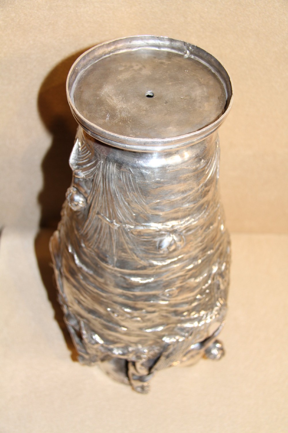 A large and decorative silver plated vase embellished with water nymphs  casting their nets into a lake. View IX