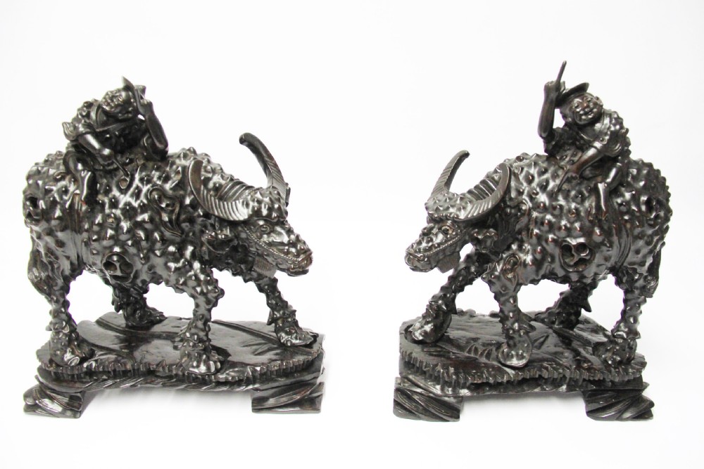 A pair of Chinese hardwood buffalo