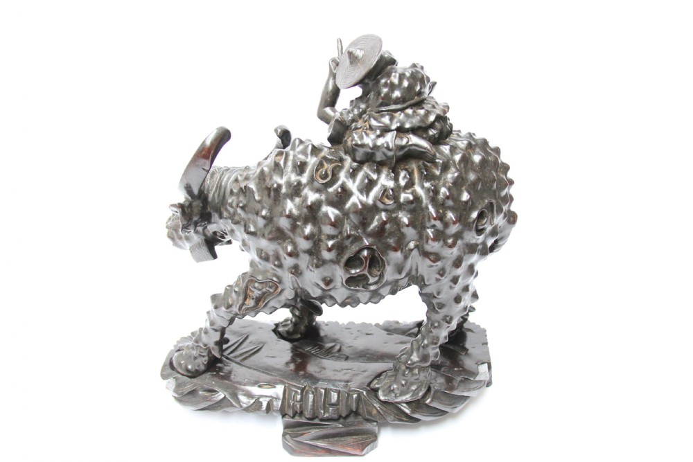 A pair of Chinese hardwood buffalo View VI