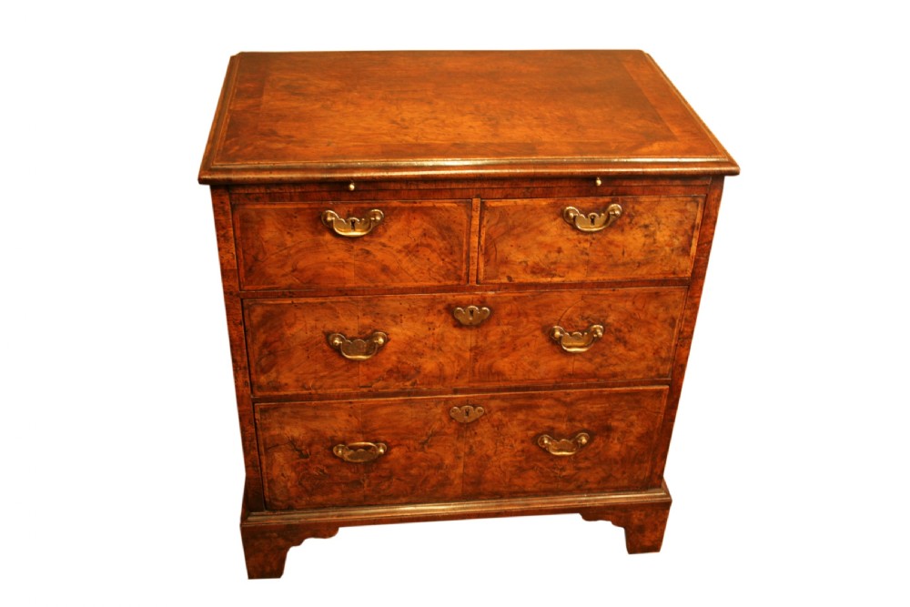 A rare small George I figured walnut Chest of Drawers
