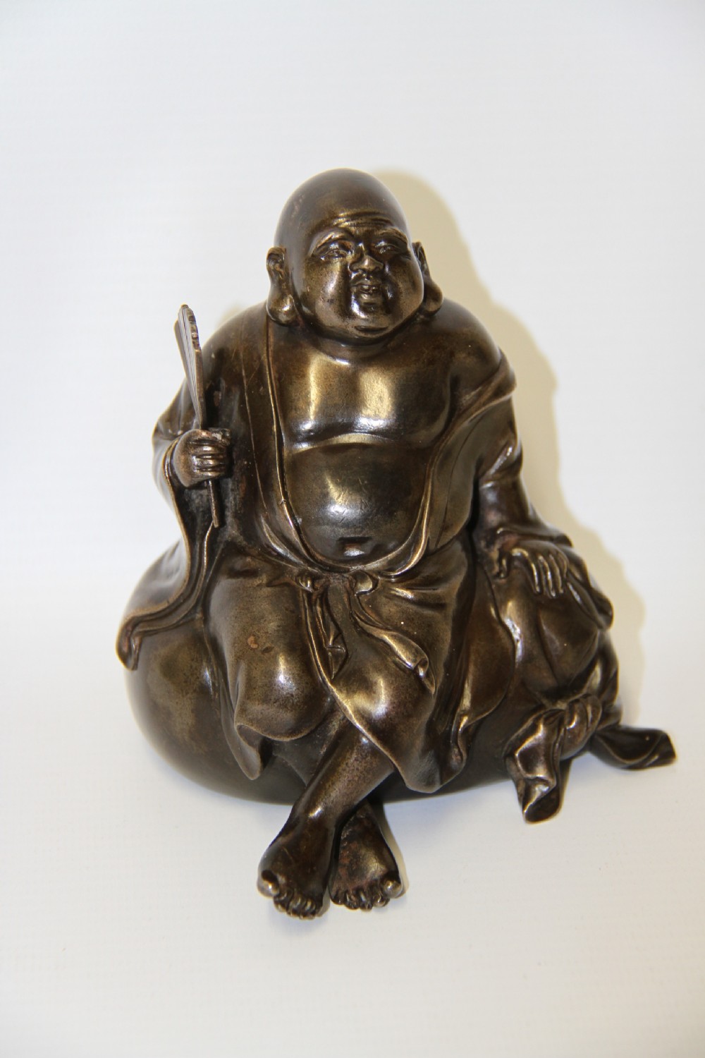 A humorous late 19th century bronze okimono 