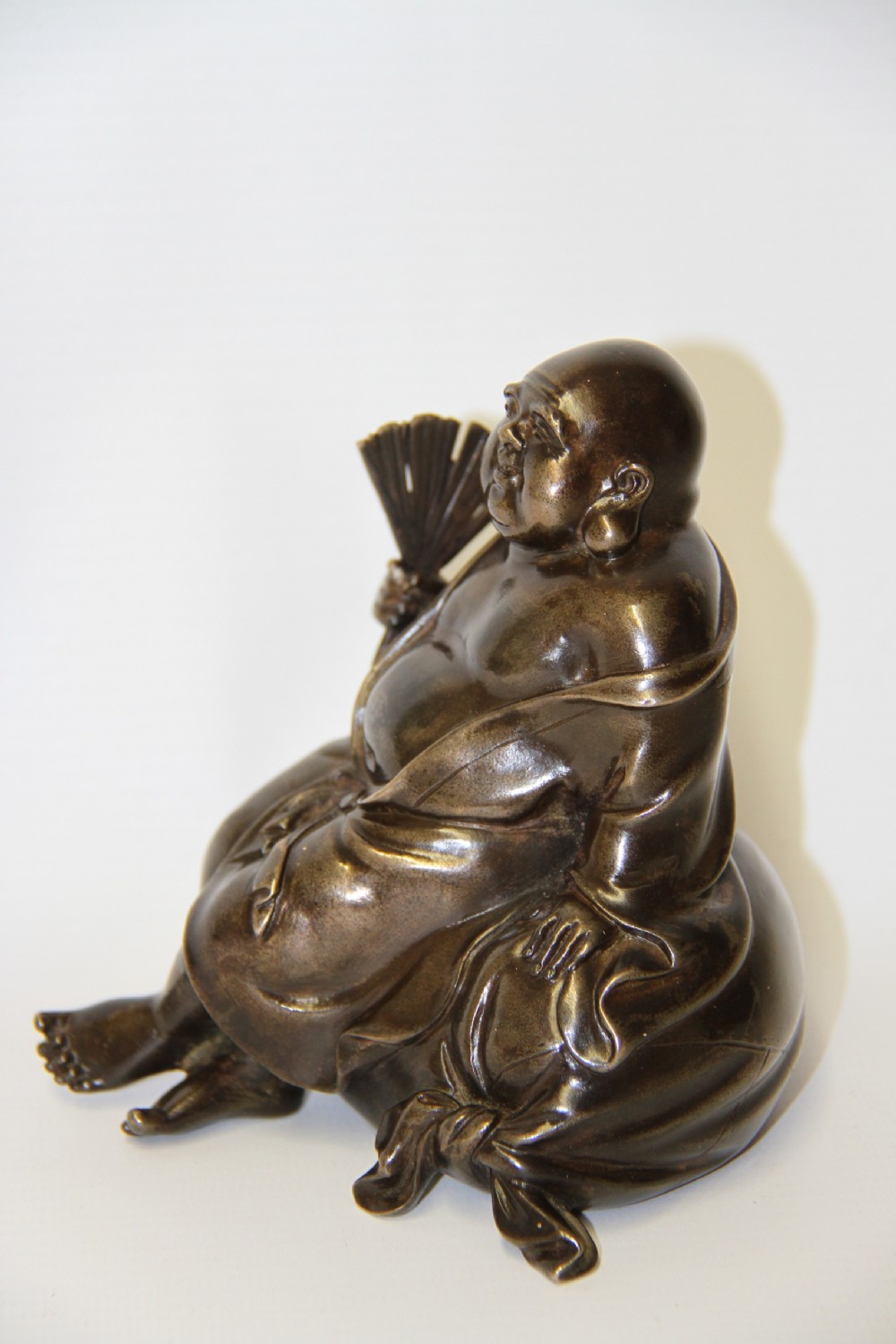 A humorous late 19th century bronze okimono  View II