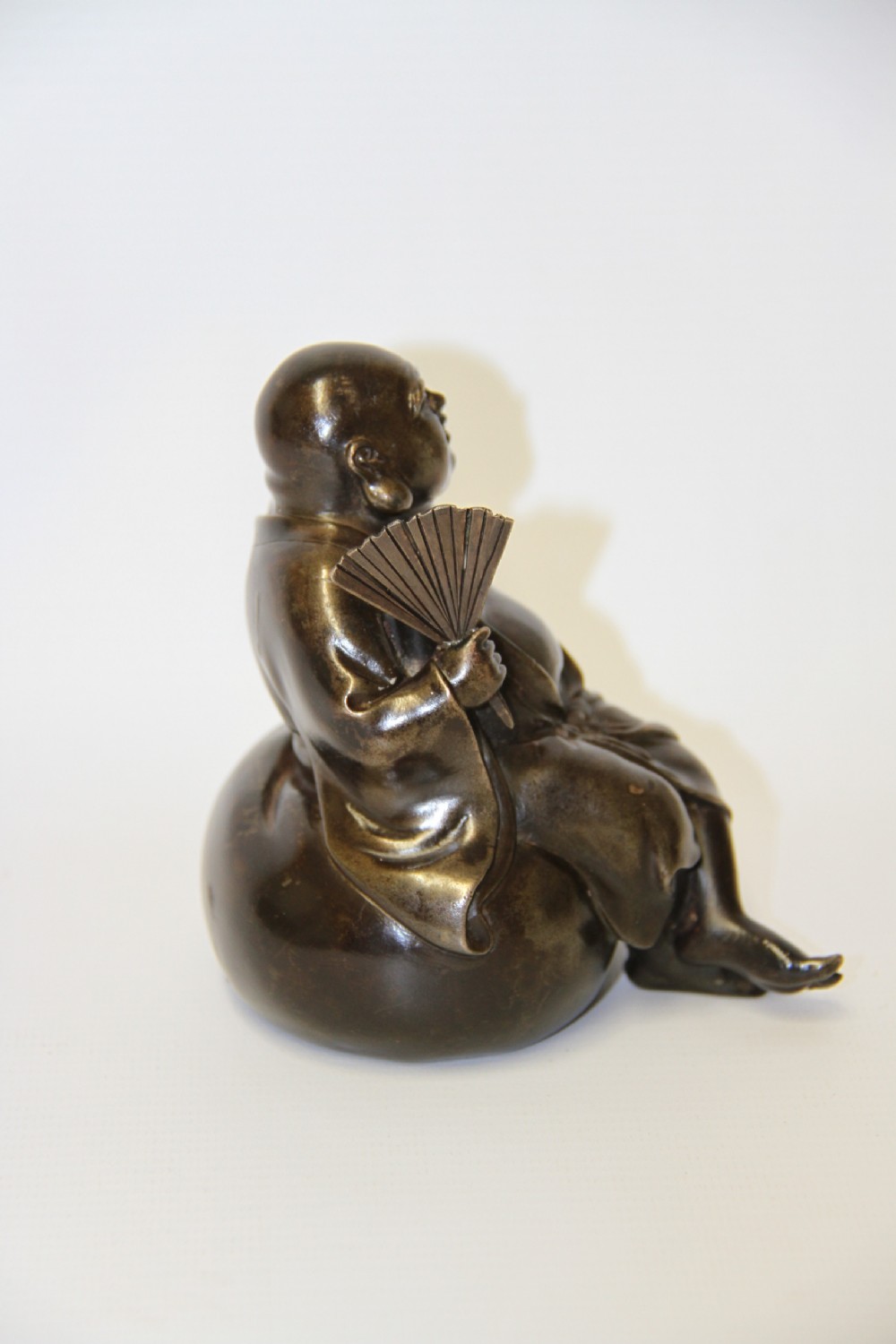 A humorous late 19th century bronze okimono  View V