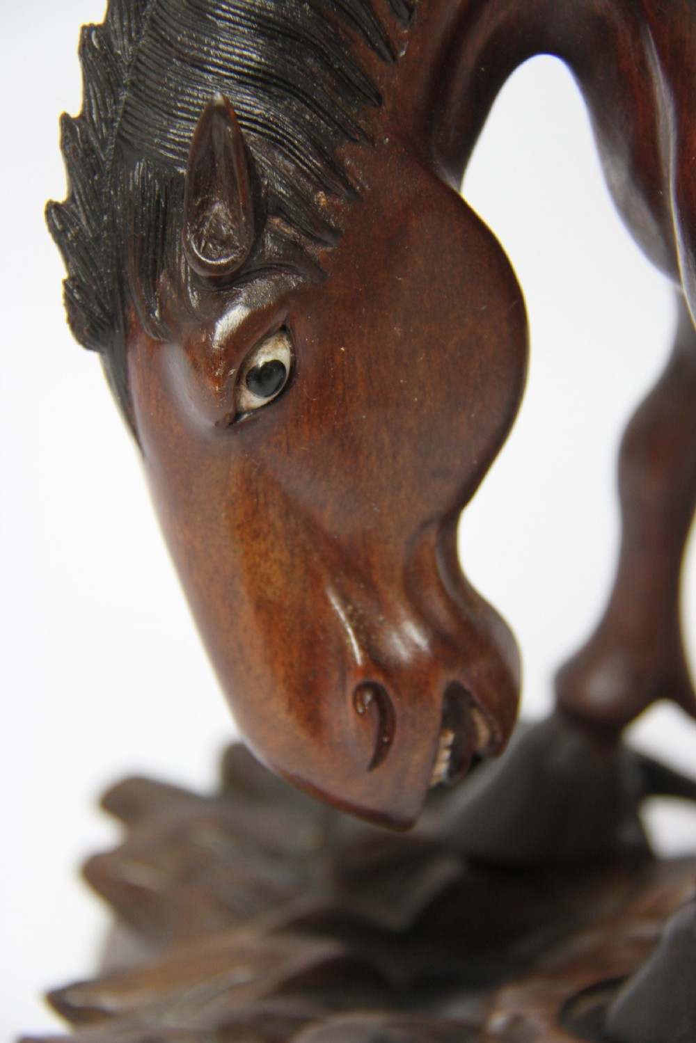 A 19th century Chinese carved hardwood study of a Horse View III