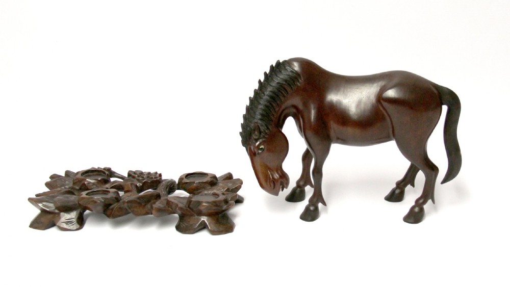A 19th century Chinese carved hardwood study of a Horse View VII