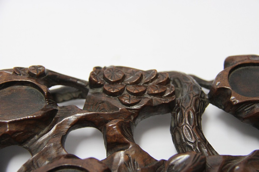 A 19th century Chinese carved hardwood study of a Horse View VIII