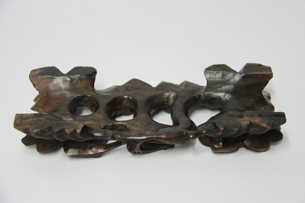 A 19th century Chinese carved hardwood study of a Horse View IX