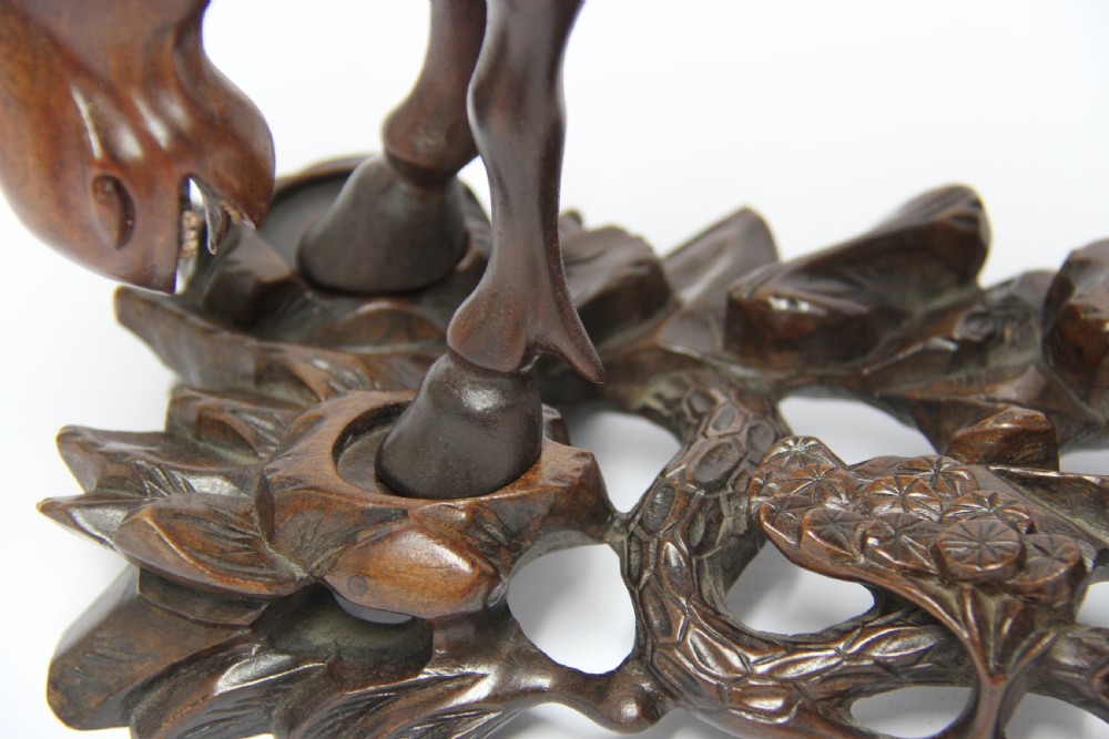 A 19th century Chinese carved hardwood study of a Horse View XIV