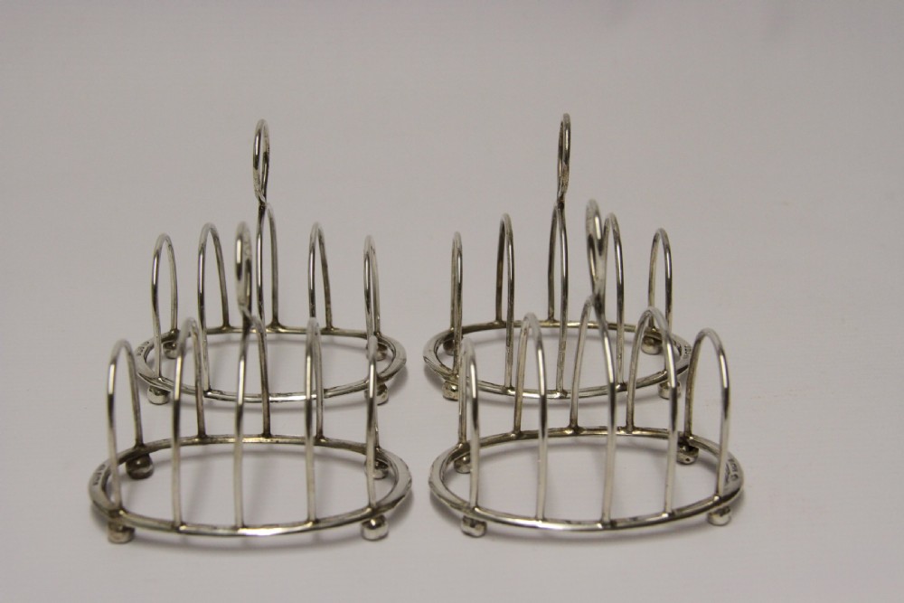 A rare set of four silver toast racks View III