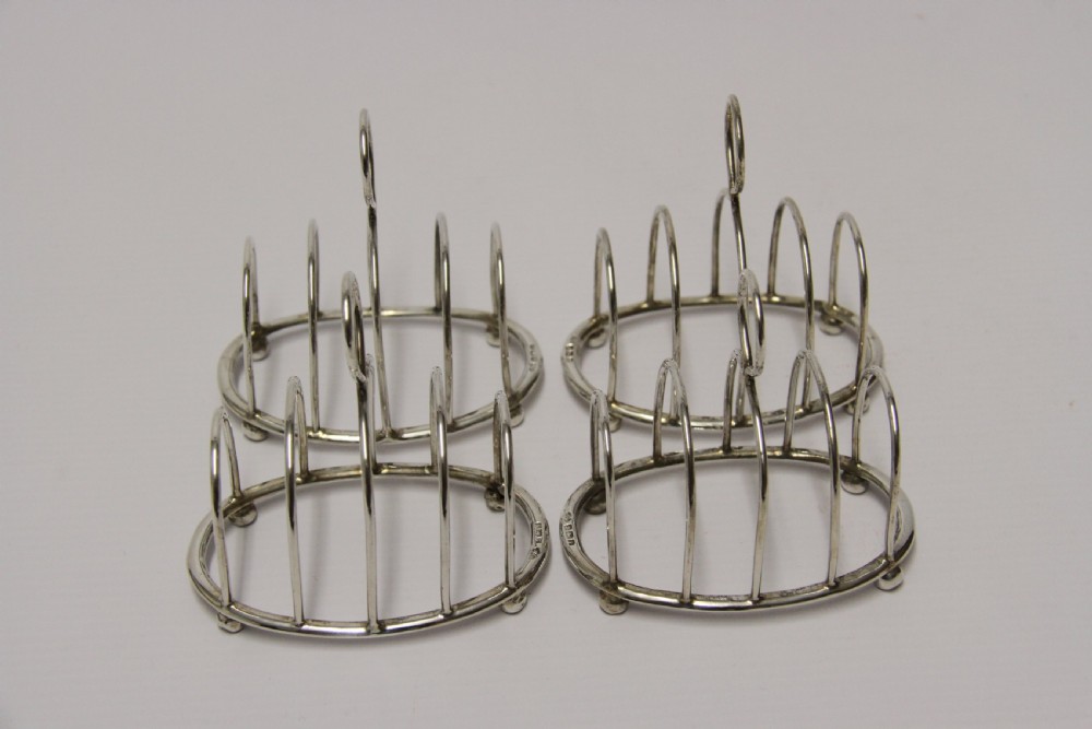 A rare set of four silver toast racks View V