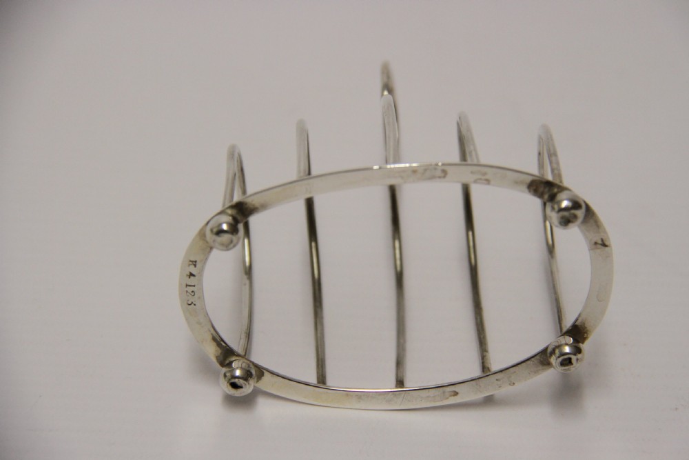 A rare set of four silver toast racks View VI