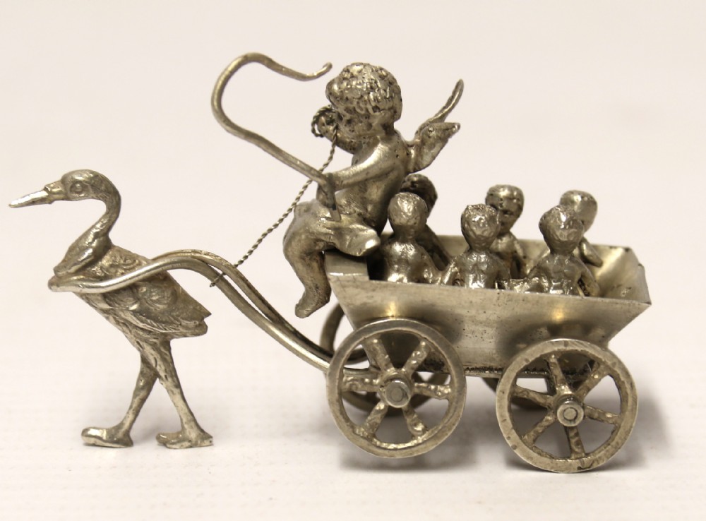 Miniature Silver figure group with cherub