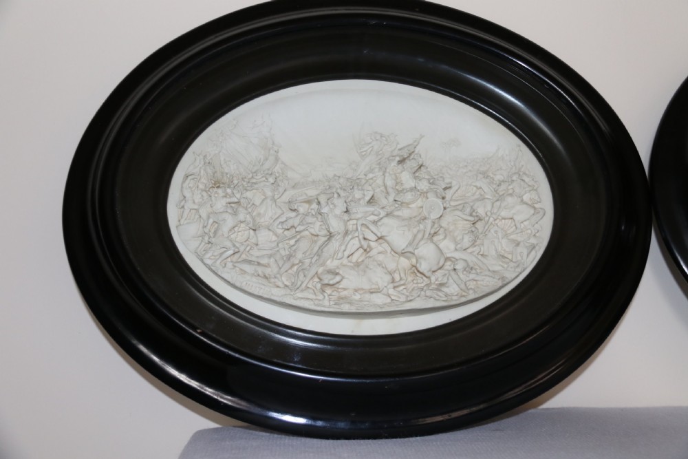 A pair of French oval plaques cast in plaster View IV