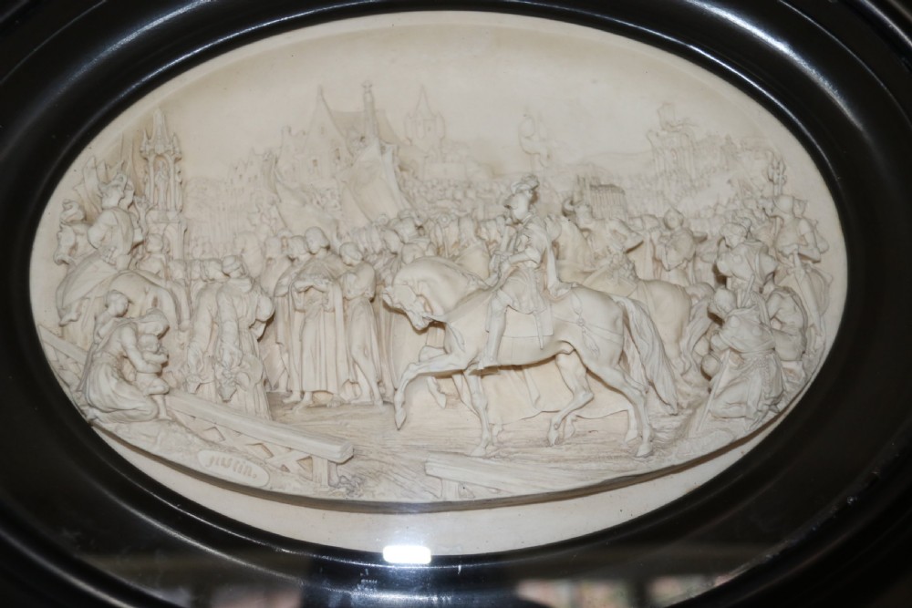 A pair of French oval plaques cast in plaster View V