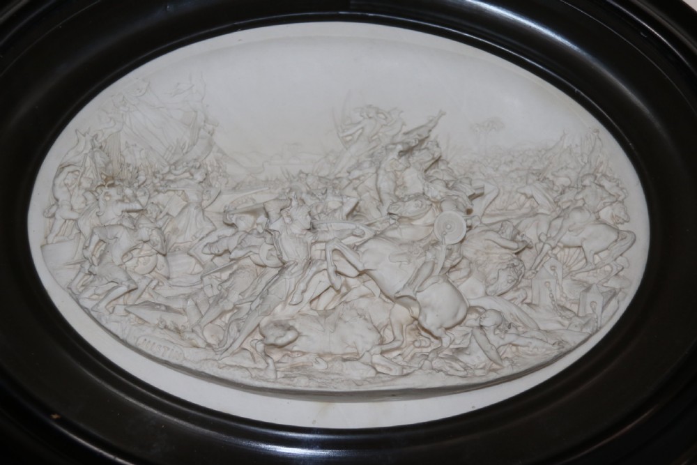 A pair of French oval plaques cast in plaster View VI