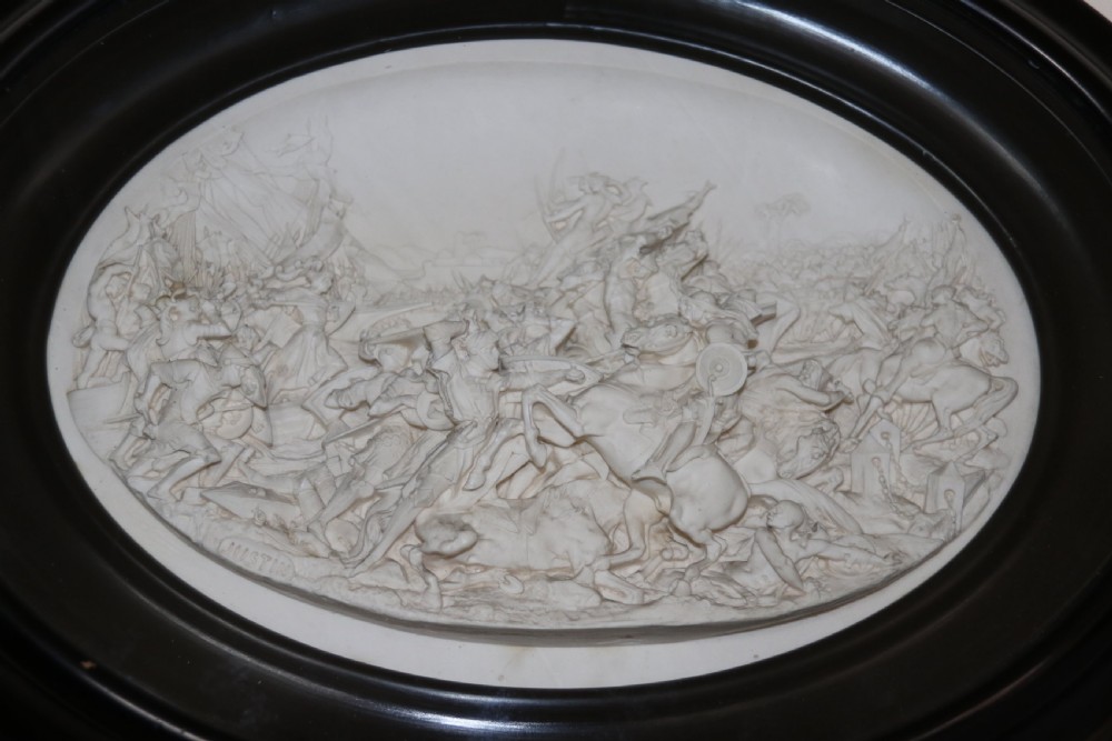 A pair of French oval plaques cast in plaster View X