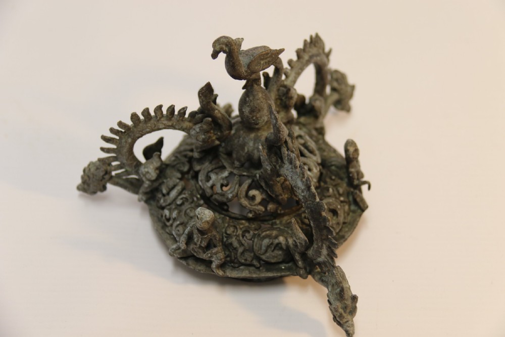 A dark patinated bronze hanging incense burner featuring dragon openwork motifs and a bird finial suspended by three link chains. View XV