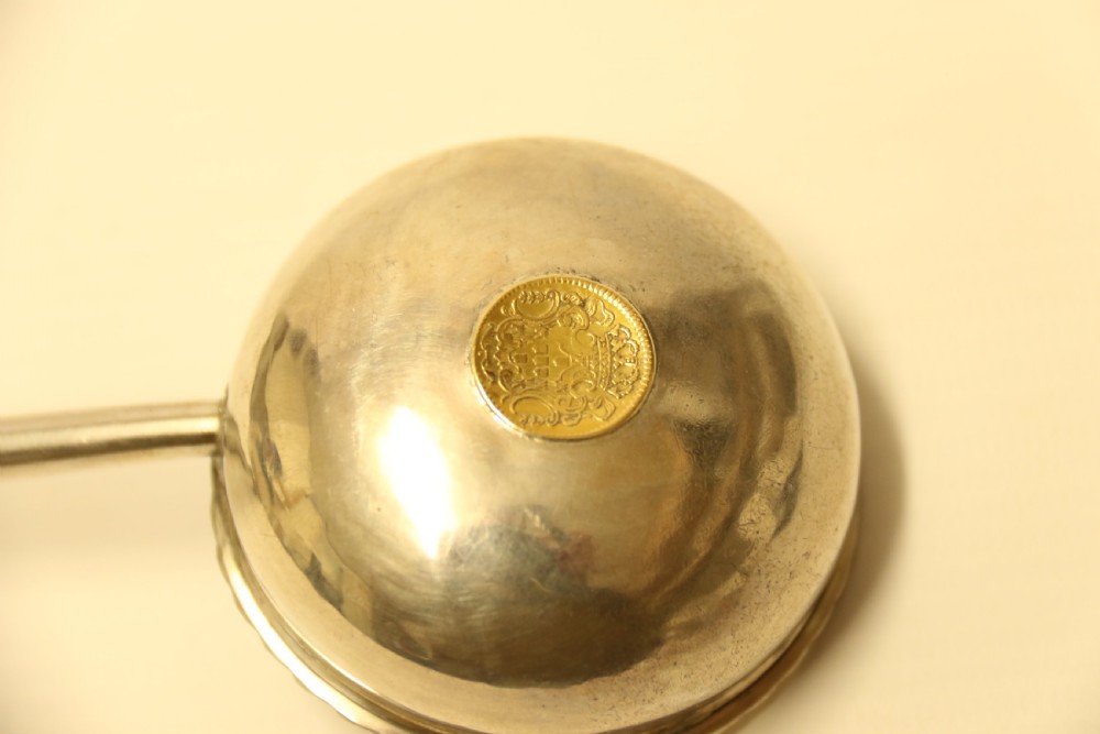 A Georgian Silver Toddy Ladle with inset coin View VI