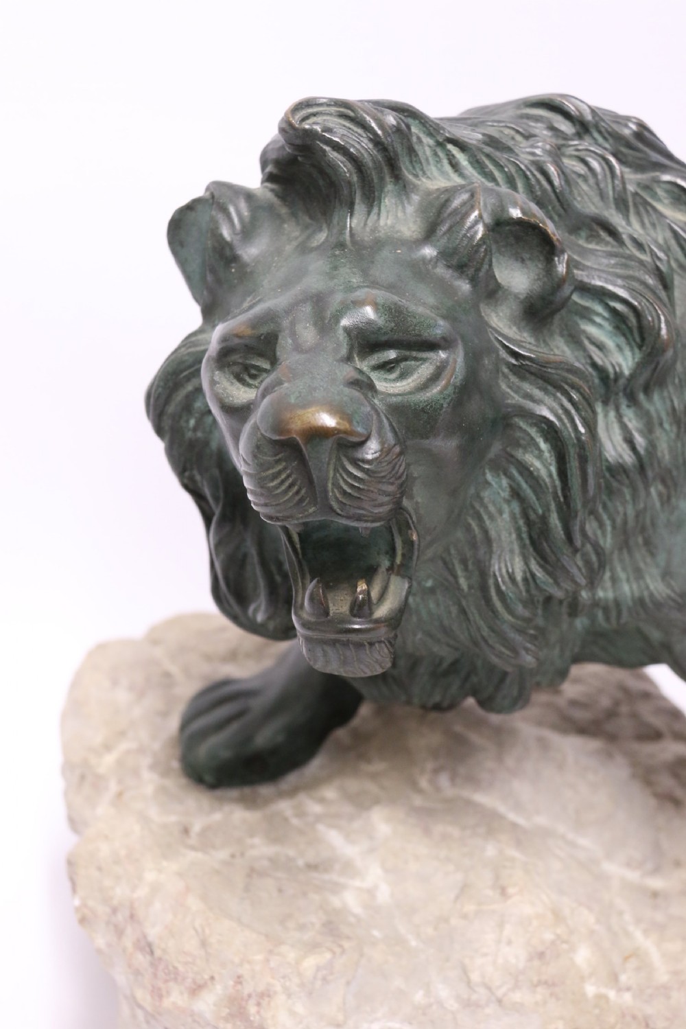 Early 20th century Bronze study of a Lion mounted on limestone base View II